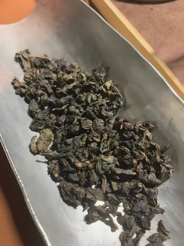 Loose leaf Iron Goddess Oolong tea with floral aroma and smooth, earthy flavor, ideal for digestion, relaxation, and overall health