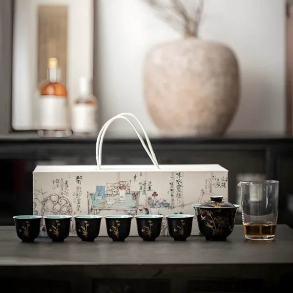 Elegant Black and Gold Hand-Painted Bamboo Polished Ceramic Tea Set with cups and teapot displayed on a table for tea lovers.