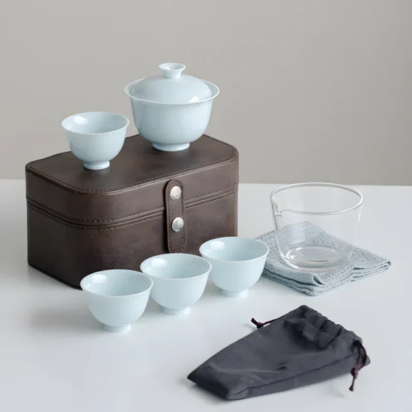 Chinaware celadon blue travel tea set with travel gaiwan and tea cups.