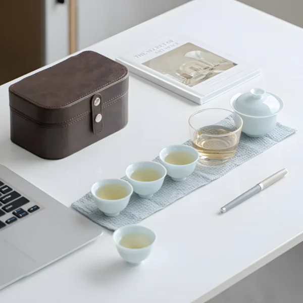 Celadon home camping tea set with blue and white porcelain tea cups and gaiwan.