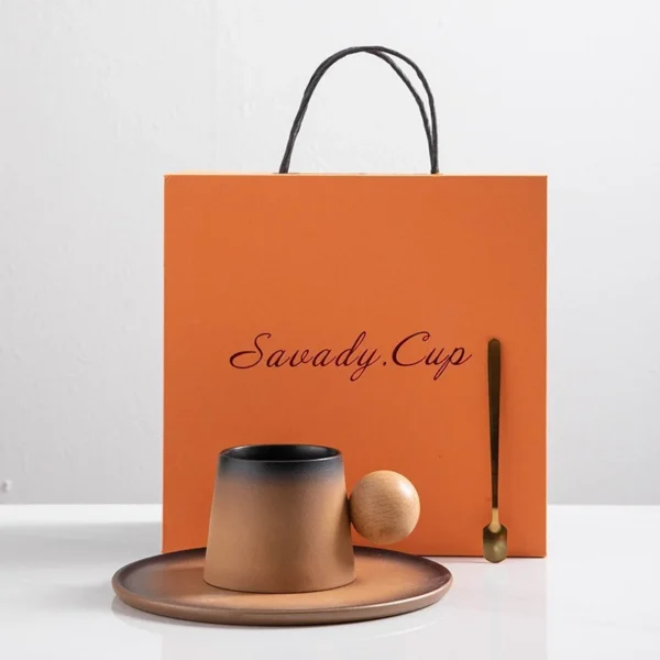 China coffee cups with a wooden handle, paired with a coffee cup saucer and metal spoon, ideal for enjoying a big cup of coffee.