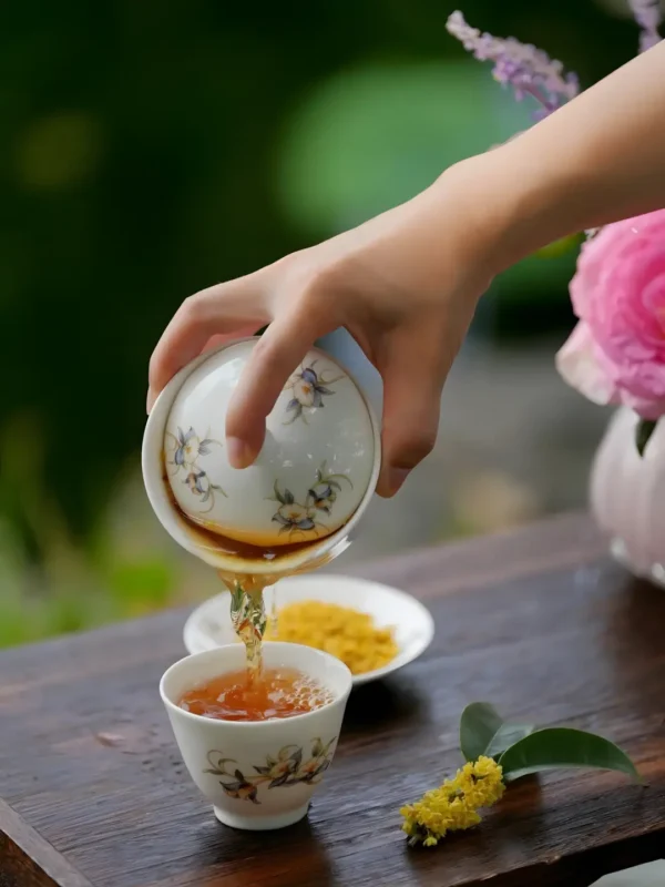 A cup of osmanthus black tea with osmanthus fragrance, offering slimming tea detox and a calm and relax tea experience.