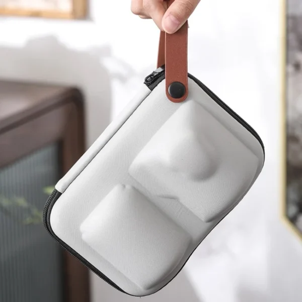 Compact and lightweight storage bag designed to carry a portable tea set for travel use.