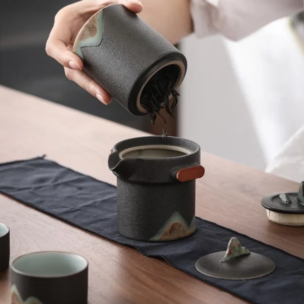 Elegant Gong Fu tea set featuring a ceramic teapot with diffuser, Chinese teapot and cups, ideal for traditional tea rituals.