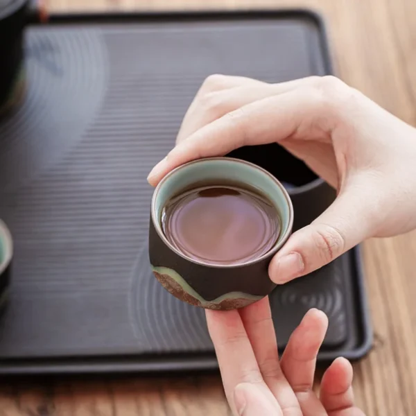 Close-up of a ceramic tea cup from a Chinese tea ceremony set, part of a tea cup pot collection with intricate craftsmanship.