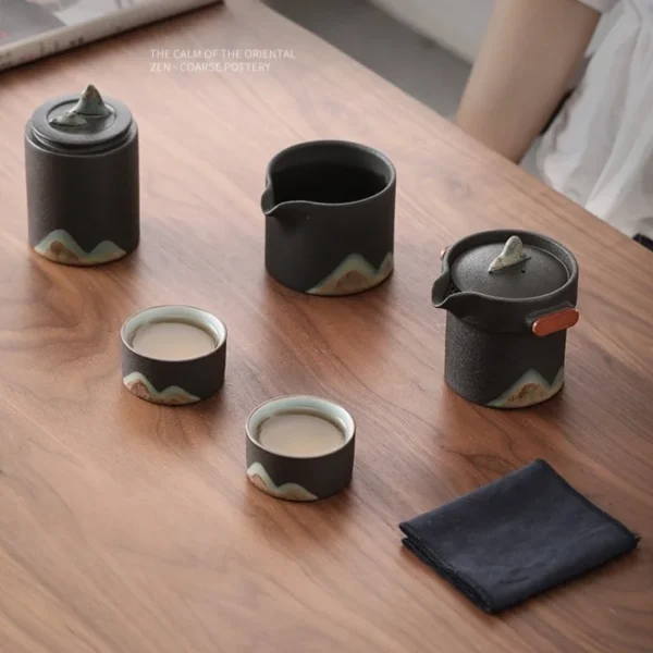 A beautifully crafted ceramic tea set featuring tea cup pots, a teapot with strainer in pot, and minimalist artistic design.