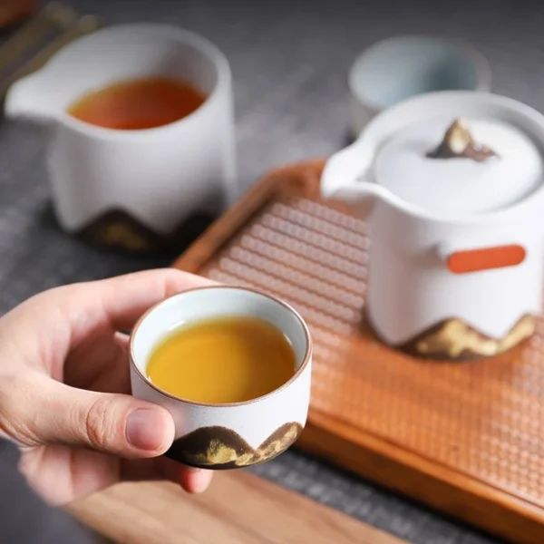 Chinese tea cups with saucer, small tea cups, and a china tea cup in a teapot and cup set for elegant tea moments