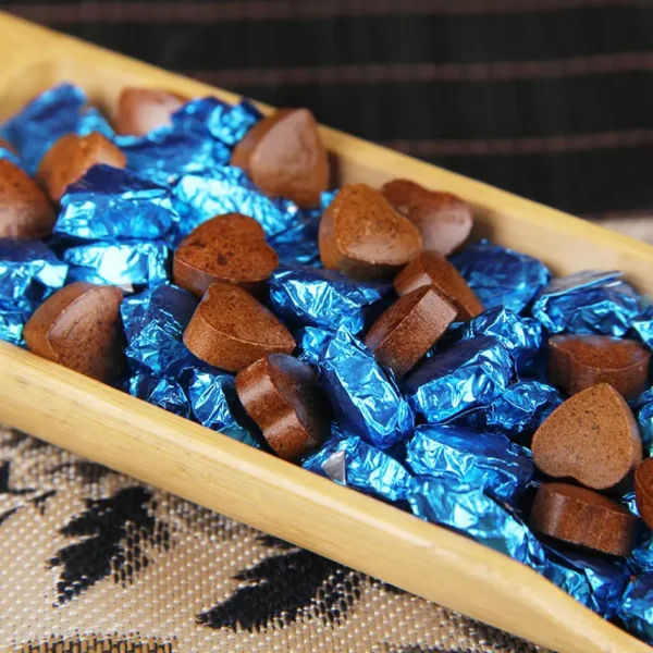 Heart-shaped jasmine Pu'er tea paste from Yunnan, solid instant tea, featuring rich floral aroma and authentic fermented flavor.