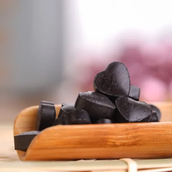 Heart-shaped Pu'er tea solid paste from Yunnan Menghai, featuring natural rose infusion for a healthy and convenient tea experience.